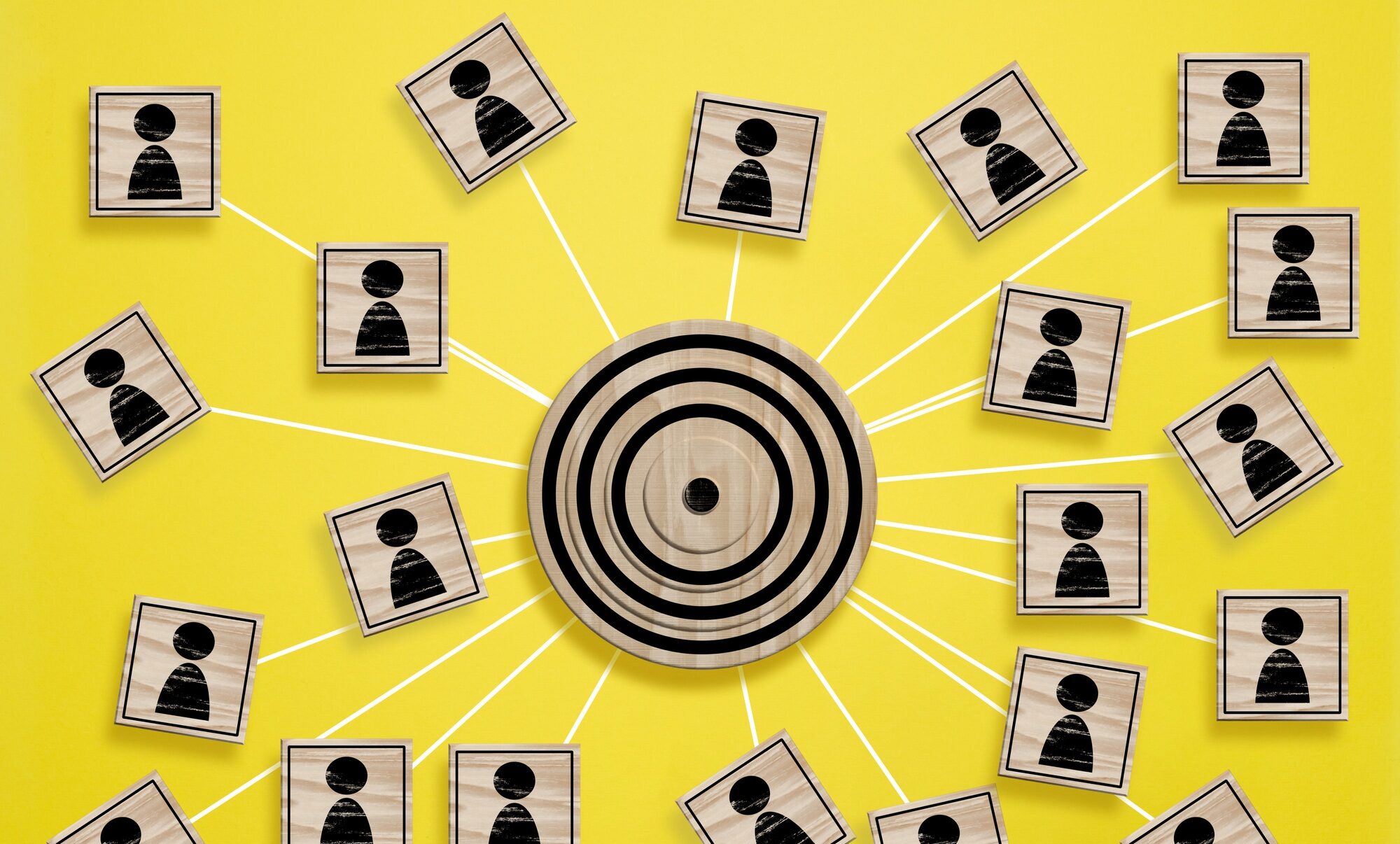 A wooden round target and wooden cubes with figure icon are connected